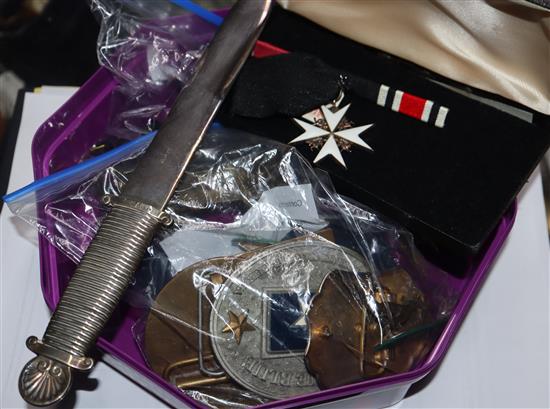 A collection of military items, medals and badges